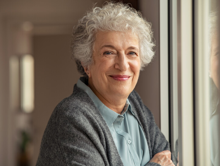 Happy senior woman smiling at home